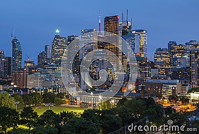 Night view from a high-rise building of Moss Park Arena with nearby skyscrapers Editorial Stock Photo