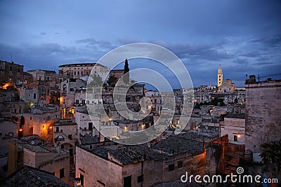 Night view of the houses and illuminated streets of Sasso Barisano, district of Matera, European Capital of Culture 2019 Stock Photo