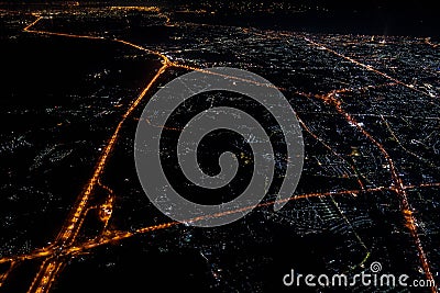 Night view from the jetplane in twilight time with the red sky and light of the city Stock Photo