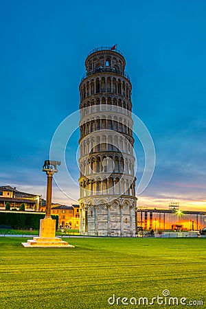 Night view of the leaning tower of Pisa and statue of romulus and remus...IMAGE Stock Photo