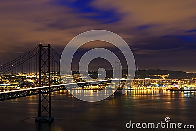 Night view of Lisbon and 25th of April Bridge Stock Photo