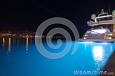 Night view of Mali LoÅ¡inj harbor and marina in medieval old town Mali LoÅ¡inj. Mooring luxury yachts, boats and other vessels on Stock Photo