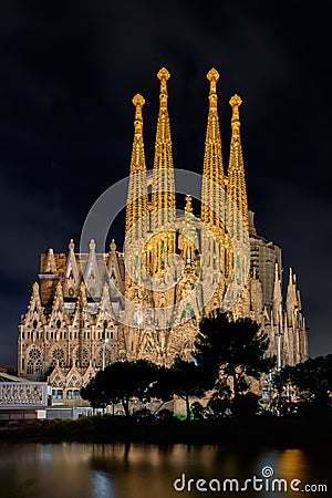 Night view of Nativity facade of Sagrada Familia cathedral in Ba Editorial Stock Photo