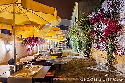 Night view of an open air restaurant in Obidos village, Portug Stock Photo