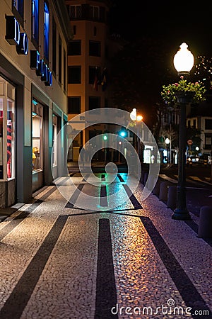 Night view over street of Funchal with its famous black an white ancient pavement Editorial Stock Photo