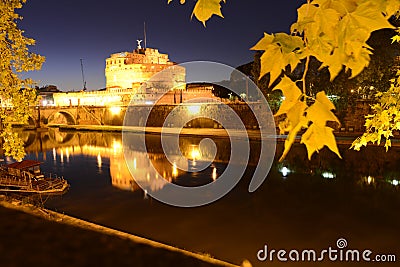 Night view over the Tevere river and the Sant'Angelo castle and bridge Stock Photo