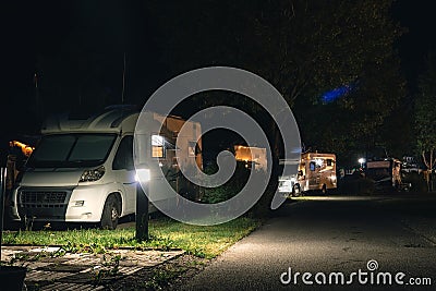 Night view of the parking lot for a motorhome, camper van, campsite camp for sleeping and relaxing. vacation and travel tour Stock Photo