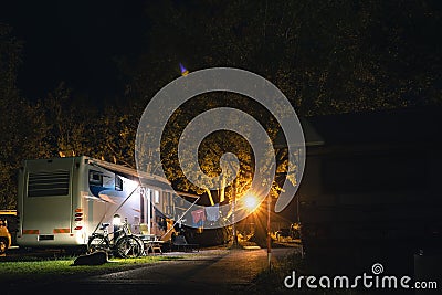 Night view of the parking lot for a motorhome, camper van, campsite camp for sleeping and relaxing. vacation and travel tour Stock Photo