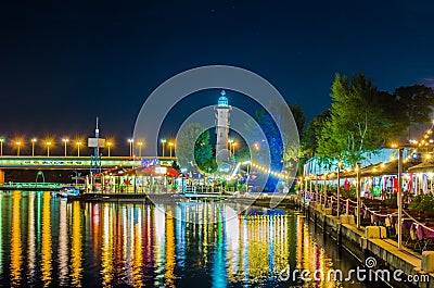 Night view of restaurants on the shore of donau river near VIC and Donauturm in Vienna, Austria....IMAGE Stock Photo