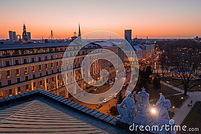 Night view of Riga seen through Latvian National Opera statue Stock Photo