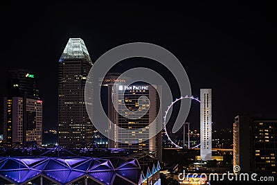 Night view Singapore Downtown, Marina Bay and Big Wheel Editorial Stock Photo