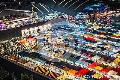 Night view of the Train Night Market Ratchada, also known as Talad Nud Rod Fai, is a new flea market place at Bangkok, Thailand. Editorial Stock Photo