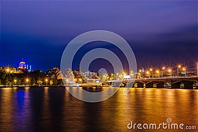 Night Voronezh skyline, bridge, modern houses, river. Copyspace Stock Photo