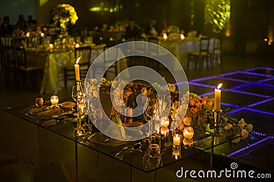 Night wedding decoration with candles and natural flowers Stock Photo