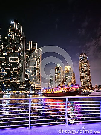 Nightfall in the Concrete Jungle: A Captivating Cityscape Bathed in Moonlight Editorial Stock Photo