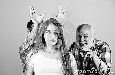 Nightmare concept. Psychology anxiety. Anxiety problem. Girl doubts herself. Pangs of conscience. Men behind lady pursue Stock Photo