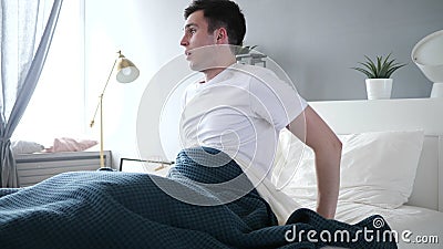 Nightmare, Sleeping Man Waking Up in Shock Stock Photo