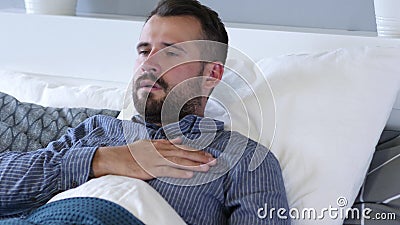 Nightmare, Sleeping Young Man Waking Up in Fear Stock Photo