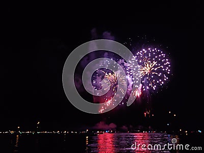 Nightsky Fireworks on water Stock Photo