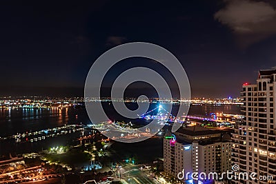 Nighttime city lightson the harbor near the USS Midway on San Diego Bay in Southern California Editorial Stock Photo