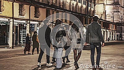 Nighttime City Walk with Friends Editorial Stock Photo