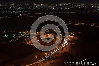 Nighttime long exposure of Viewpoint of twisted highway on Jebal Hafeet Stock Photo