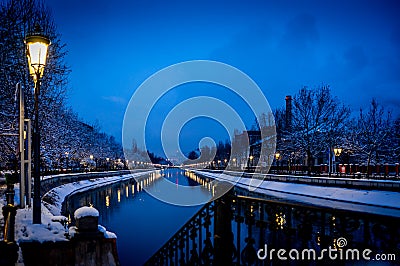 Nighttime view of a snowy day in Bucharest, Romania, along Splaiul Independentei Stock Photo