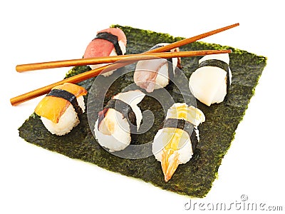 Nigirizushi sushi over nori sheet Stock Photo