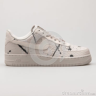 Nike Air Force 1 07 LX beige and black paint splash sneaker Editorial Stock Photo