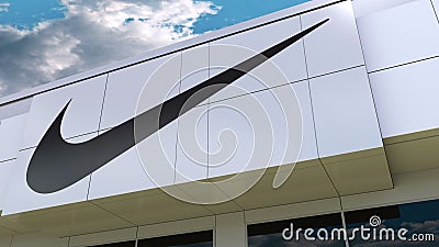 Nike inscription and logo on the modern building facade. Editorial 3D rendering Editorial Stock Photo