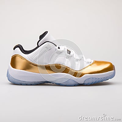 Nike Jordan 11 Retro Low white and gold sneaker Editorial Stock Photo