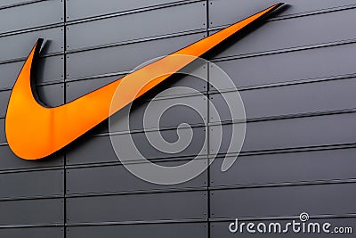 Nike Swoosh Logo at Metzingen Outlet Shopping Complex in Germany Editorial Stock Photo