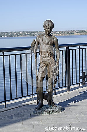 Nikolaev, Ukraine - September 20, 2020: bronze statue of a boy with a goby fish and a cat Editorial Stock Photo