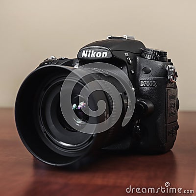 Nikon dslr camera on wooden table, close up Editorial Stock Photo