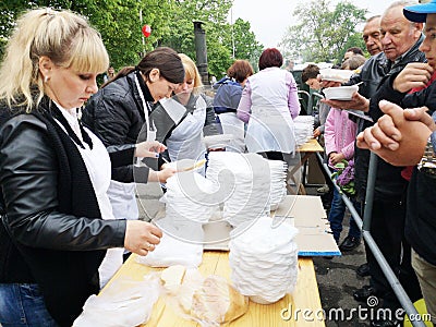 NIKOPOL, UKRAINE - MAY, 2019: distribution of food to the needy, charity event Editorial Stock Photo