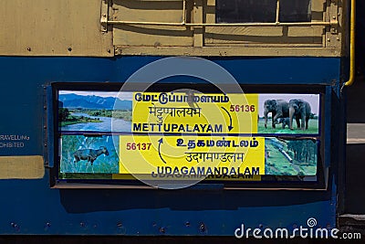Nilgiri mountain railway. Blue train. Unesco heritage. Narrow-gauge. Sign indicate Mettupalayam to Udagamandalam Editorial Stock Photo