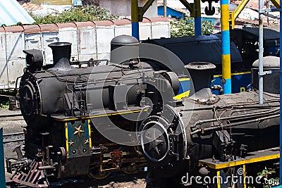 Nilgiri mountain railway. Blue train. Unesco heritage. Narrow-gauge. Steam locomotive in depot Stock Photo