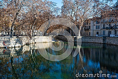 Nimes, Occitanie, France, Water ponds and monuments in roman style of the Fountain parks and garden Editorial Stock Photo
