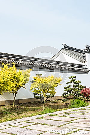 Ninety-nine and a half antique folk houses white wall Stock Photo