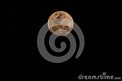Ninety Nine Percent Full Moon in a hazy smoky night sky Stock Photo