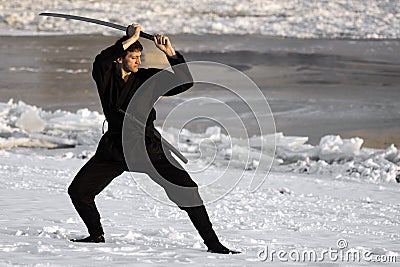 Ninja with sword at winter Stock Photo