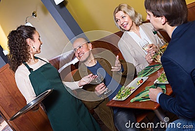 Nippy serving table with adults Stock Photo