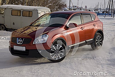 Nissan Qashqai in red color. This is crossover that combines modark design and compact hatchback refinement with functionality Editorial Stock Photo