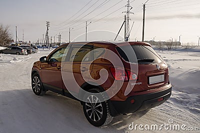 Nissan Qashqai in red color. This is crossover that combines modark design and compact hatchback refinement with functionality Editorial Stock Photo