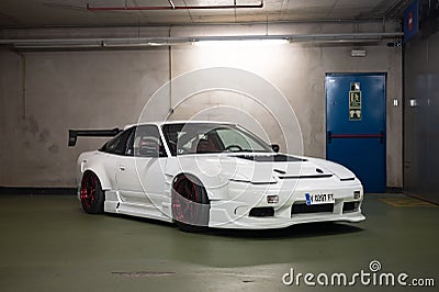 Nissan Silvia S13 with spoiler and body kit in an underground garage Editorial Stock Photo