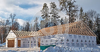 NISSWA, MN - 22 NOV 2021: Home construction site with new wood roof trusses Editorial Stock Photo