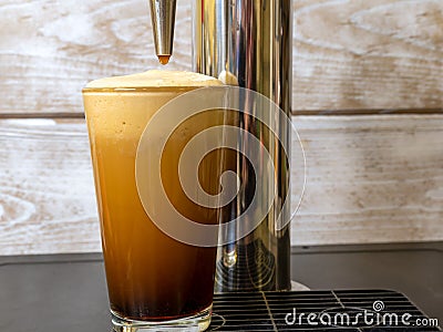 Nitro Cold Brew coffee in a clear glass Stock Photo