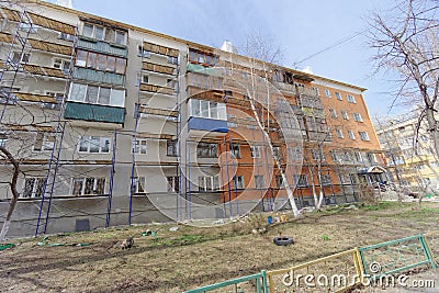 Nizhny Novgorod, Russia. - April 28.2018. Hasty repairs and painting of the facades of buildings near the football Editorial Stock Photo