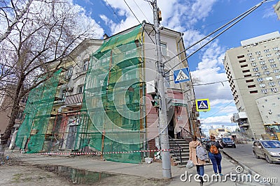 Nizhny Novgorod, Russia. - April 27.2018. Hasty repairs and painting of the facades of buildings near the football stadium on Mura Editorial Stock Photo