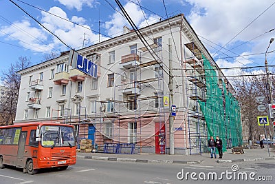 Nizhny Novgorod, Russia. - April 27.2018. Hasty repairs and painting of the facades of buildings near the football stadium on Mura Editorial Stock Photo